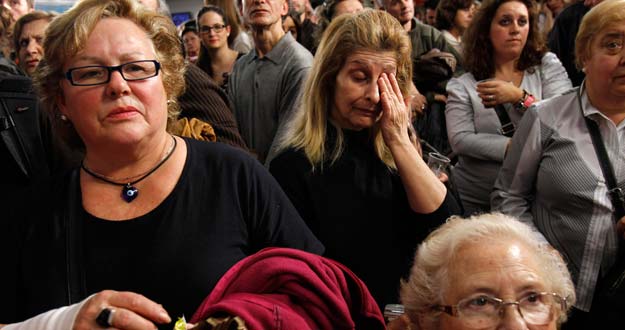 Supporters of prime ministerial candidate Alfredo Perez Rubalcaba of the Spanish Socialist Workers' Party (Partido Socialista Obrero Espanol) react at PSOE headquarters in Madrid