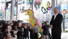 Guests look at works by Japanese artist Kitano, at the Cartier Foundation for Contemporary Art which is part of his show in Paris