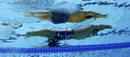 La imagen del nadador japon&eacute;s Takuro Fujii mientras nada los 100m mariposa, durante los Juegos Ol&iacute;mpicos de Londres, en el centro aqu&aacute;tico.