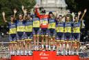 Team Saxo Bank rider Alberto Contador of Spain celebrates on the podium with his team after winning the Tour of Spain after the last stage of the 