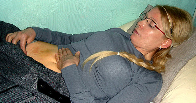 Former Ukrainian PM Tymoshenko shows what she claims an injury in the Kachanivska prison in Kharkiv, in this undated handout picture Former Ukrainian PM Tymoshenko shows what she claims an injury in the Kachanivska prison in Kharkiv, in this undated handout picture
