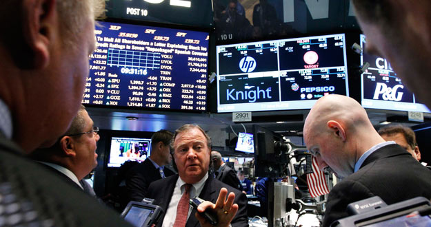 Traders gather at the Barclays Capital post that trades Knight Capital on the floor of the New York Stock Exchange Traders gather at the Barclays Capital post that trades Knight Capital on the floor of the New York Stock Exchange