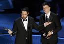 Trent Reznor and Atticus Ross accept the Oscar for best original score for 
