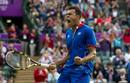 Tsonga celebrando despu&eacute;s de ganar al canadiense Raonic durante la segunda ronda del torneo de los Juegos.