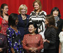 U.S. first lady Obama shares a laugh with Frances first lady Bruni-Sarkozy, and Indonesias first lady Herawati during a group photo at CAPA school during the G20 Pittsburgh Summit in Pittsburgh