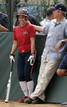 U.S. President George W. Bush watches batting practice next to U.S. Womens softball team player Andrea Duran in Beijing