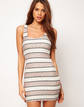 Vestido con estampado navajo y espalda cruzada de Reverse (Asos, 61,09 EUR)