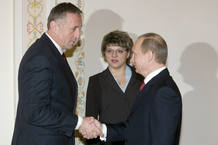 Russian PM Putin shakes hands with Czech Republic's PM Topolanek outside Moscow