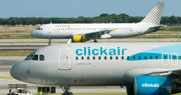 Clickair and Vueling planes are seen at El Prat airpot in Barcelona