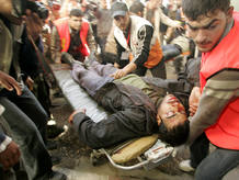 Wounded Palestinian is brought into hospital in Gaza