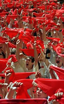 REVELERS CHEERS AS PAMPLONA FIESTA BEGINS