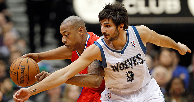 L.A. Clippers forward Caron Butler is fouled by Minnesota Timberwolves guard Ricky Rubio during the second half of their NBA basketball game in the Target Center in Minneapolis,